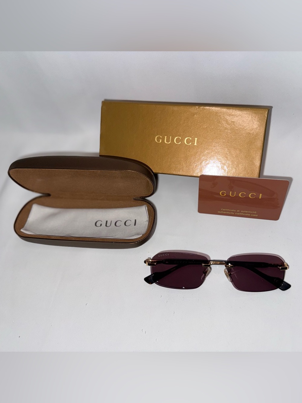 Gucci Rimless Women’s Sunglasses with Gold Accents